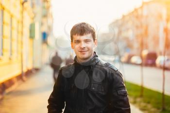 Young Handsome Man Outdoors Portrait. Autumn Colors In City. Toned Photo