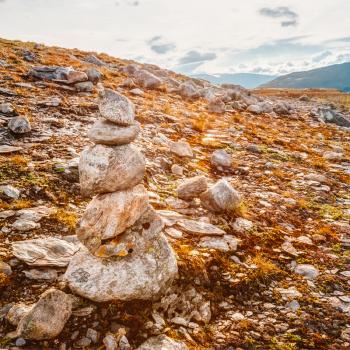 Stack Of Rocks Stones On Norwegian Mountain, Norway Nature. Toned Instant Photo