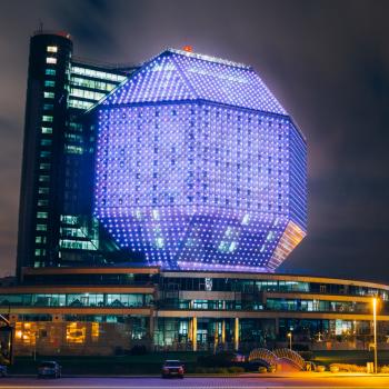 MINSK, BELARUS - SEPTEMBER 28, 2014: Unique Building Of National Library Of Belarus In Minsk At Night Scene. Building Has 23 Floors And Is 72-metre High. Library can seat about 2,000 readers and featu