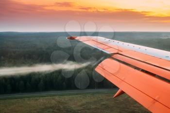 Minsk, Belarus. Twist Of Air On Wings Of Plane During Landing, Reduction Or Abrupt Maneuver Of Aircraft.