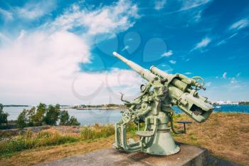 Historic cannon at Suomenlinna, Sveaborg maritime fortress In Helsinki, Finland. Sunny Day With Blue Sky. UNESCO World Heritage Site