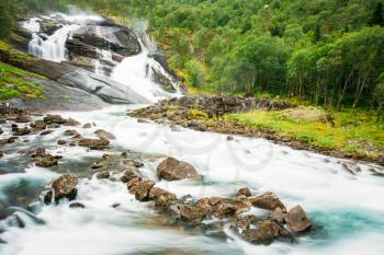 Waterfall in the Valley of waterfalls in Norway. Husedalen Waterfalls were a series of four giant waterfalls in the South Fjord.