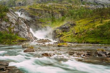 Giant beautiful waterfall in the Valley of waterfalls in Norway. Husedalen Waterfalls were a series of four giant waterfalls in the South Fjord.