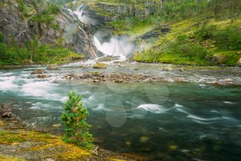 Beautiful Waterfall In The Valley Of Waterfalls In Norway. Husedalen Waterfalls Were A Series Of Four Giant Waterfalls In The South Fjord.