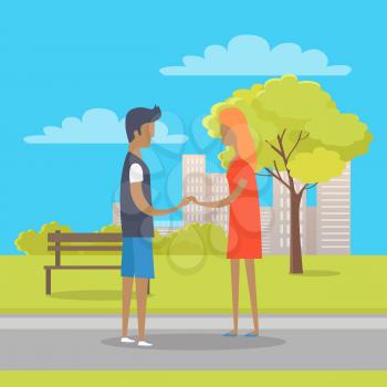 Young boy and girl in love stand on park path in nice summer weather. Isolated couple holding hands near wooden bench and green tree on grass on background with urban buildings vector illustration