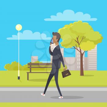 Businessman in suit and with briefcase walks in city park and talks by phone. There is bench streetlight, tree and bushes, clouds and skyscrapers behind him. Vector illustration of cartoon character.