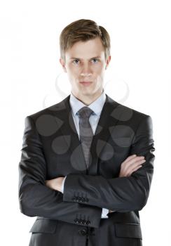 A young businessman with his arms crossed  a stern look. isolated on white