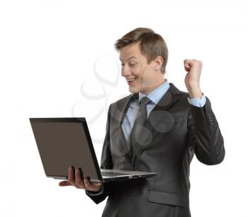 businessman with laptop celebrating victory with clenched fists and raised his hand. isolated on white