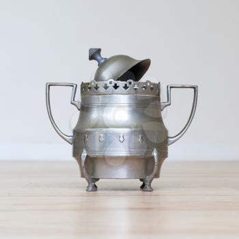 Retro silver sugar bowl, isolated on a table
