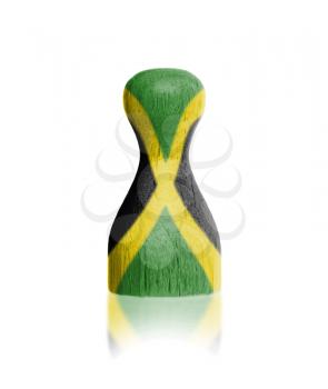 Wooden pawn with a painting of a flag, Jamaica