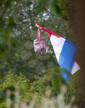 Dutch tradition of hanging the school bag with the dutch flag when passing an school exam