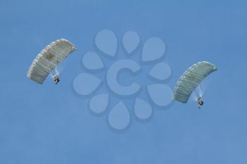 LEEUWARDEN,FRIESLAND,HOLLAND-SEPTEMBER 17: Two parachutists of the dutch army at the Airshow on September 17, 2011 at Leeuwarden Airfield