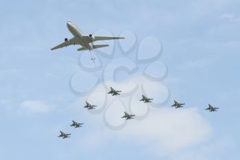 LEEUWARDEN,FRIESLAND,HOLLAND-SEPTEMBER 17: A dutch McDonnell Douglas DC-10 fueling airplane with eight dutch F-16 Fighting Falcons at the Airshow on September 17, 2011 at Leeuwarden Airfield