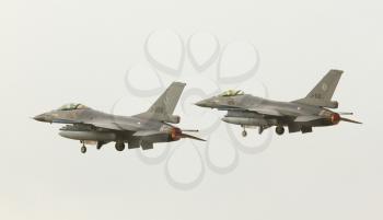 LEEUWARDEN,FRIESLAND,HOLLAND-SEPTEMBER 17: Two dutch F-16 Fighting Falcons at the Luchtmachtdagen Airshow on September 17, 2011 at Leeuwarden Airfield, Friesland, Holland.