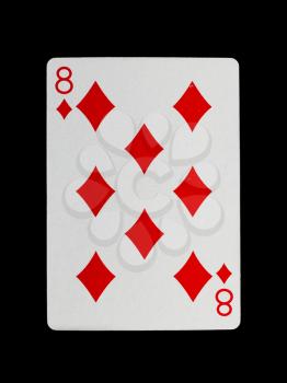 Old playing card (eight) isolated on a black background