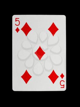 Old playing card (five) isolated on a black background