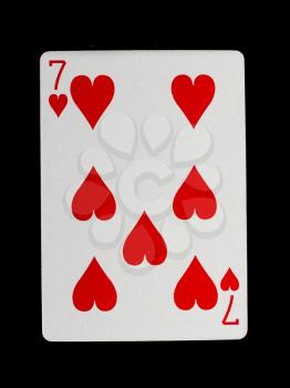 Playing card (seven) isolated on a black background