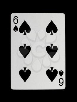 Old playing card (six) isolated on a black background