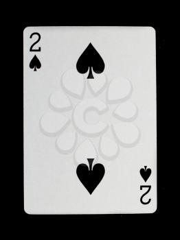 Old playing card (two) isolated on a black background