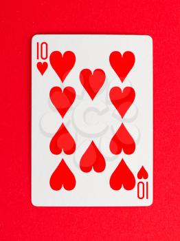 Playing card (ten) isolated on a red background