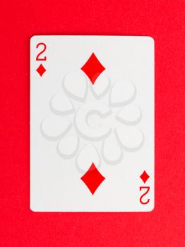 Playing card (two) isolated on a red background