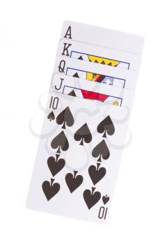 Old playing cards (royal flush) isolated on a red background