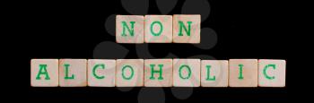 Non alcoholic spelled out in old wooden blocks