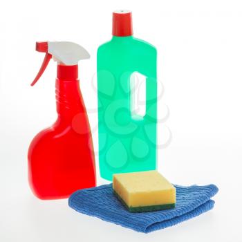 House cleaning product. Plastic bottles with detergent and sponge isolated on white background