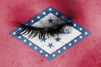 Crying woman, pain and grief concept, flag of Arkansas