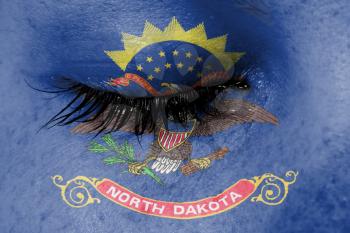 Crying woman, pain and grief concept, flag of North Dakota