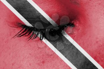 Crying woman, pain and grief concept, flag of Trinidad and Tobago