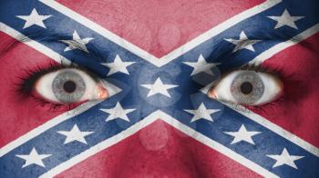 Close up of eyes. Painted face confederate flag