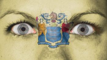 Close up of eyes. Painted face with flag of New Jersey