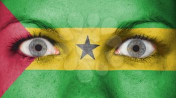 Close up of eyes. Painted face with flag of Sao Tome and Principe