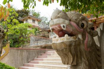 Chinese dragon ornament on a stairs in the Vietnamese jungle