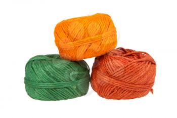 Three colours of knitting yarn isolated on a white background