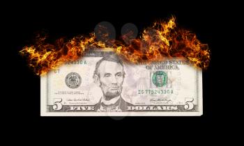 Burning five dollar bill symbolizing careless money management and the phrase money to burn