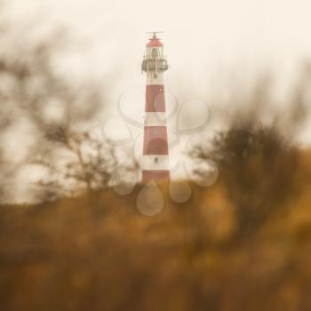 Red and white lighthouse on the dutch isle of Ameland, Holland