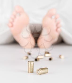 Dead body with bullets and a white sheet