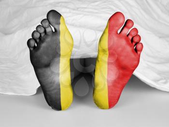 Dead body under a white sheet, flag of Belgium