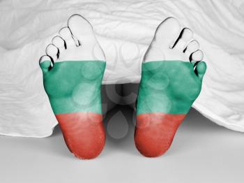 Dead body under a white sheet, flag of Bulgaria