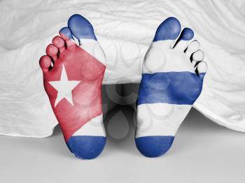 Dead body under a white sheet, flag of Cuba