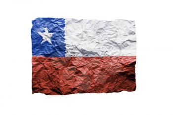 Close up of a curled paper on white background, print of the flag of Chile