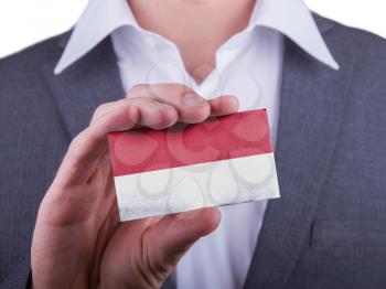 Businessman showing card, matte paper effect, Indonesia