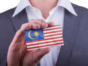 Businessman showing card, matte paper effect, Malaysia