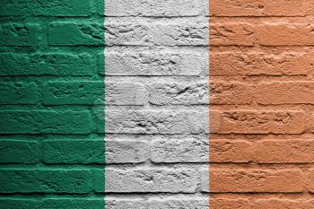 Brick wall with a painting of a flag isolated, Ireland