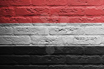 Brick wall with a painting of a flag isolated, Yemen