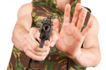 Soldier in camouflage vest is holding a gun, isolated