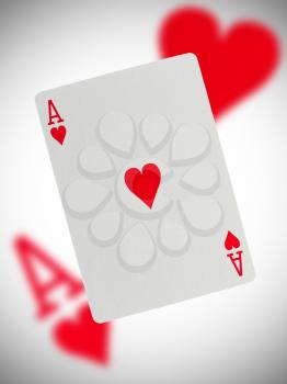 Playing card with a blurry background, ace of hearts