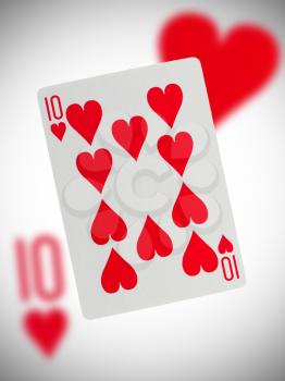 Playing card with a blurry background, ten of hearts